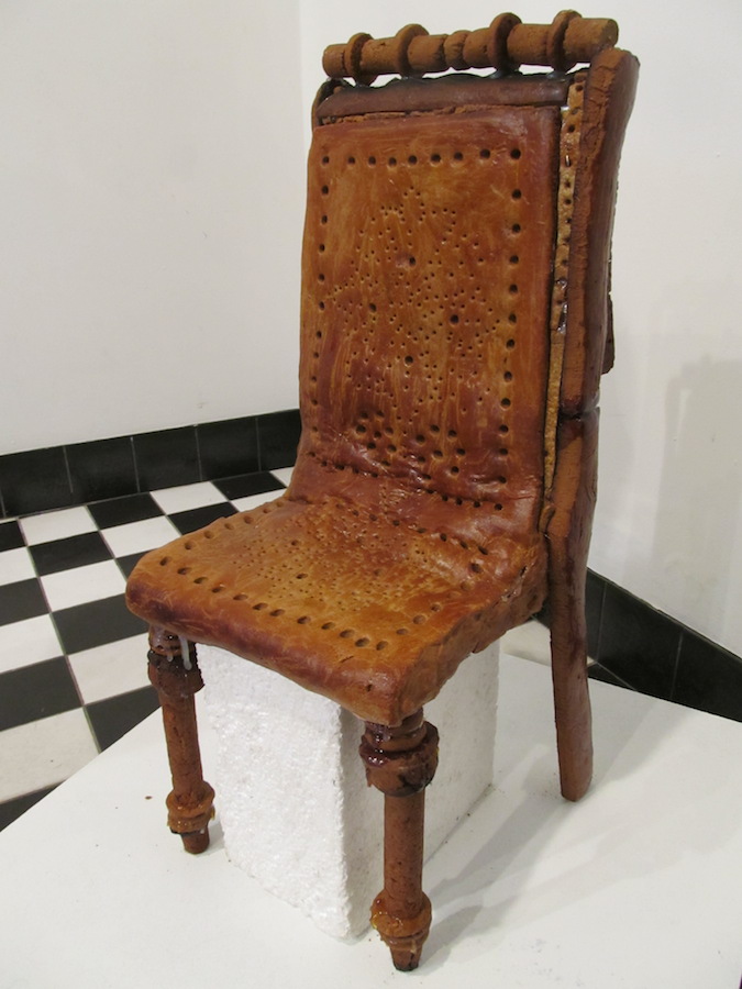 Not just any old wooden chair, but a gingerbread replica of a famed late 19th century | Lutheri tool | or plywood (|vineerist|) chair made in Tallinn's famed | A. M. Lutheri Mehaanilise Puidu/töötlemise Vabrik | / Luther Woodworking Company. From 1880 to 1940, the Luther factory was one of the world's leading plywood and furniture companies, contributing greatly to plywood production and furniture design. The Lutheri | kvartal |  (quarter) of preserved industrial buildings along Pärnu maantee in Tallinn now houses apartments and offices. This gingerbread beauty is the work of Mall Kees and Malle Pärtel.  Photo: Riina Kindlam