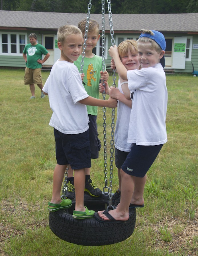 "Väiksed Poisid" playing on the tire swing, summer 2013. Photo by Peeter Põldre