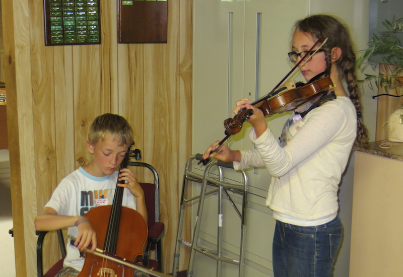 Lukas and sister Amelie Schuler-Desnoyers presenting musical entertainment at the AEHS Summer Social