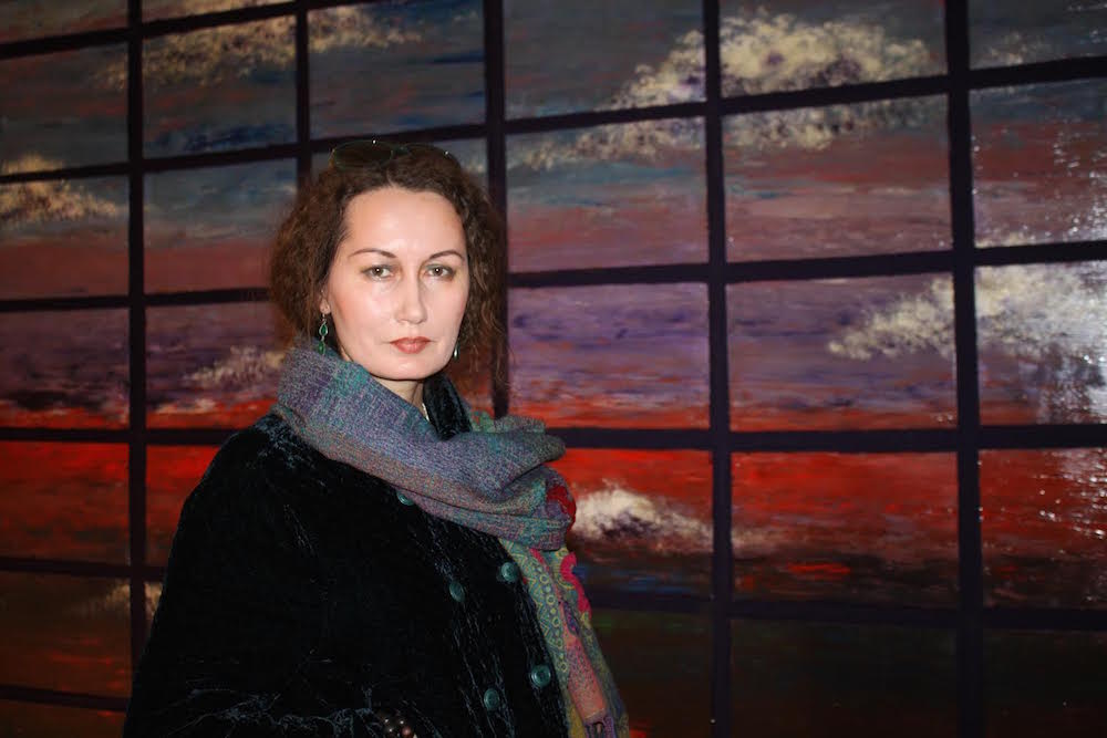Kazakh artist Leyla Mahat (1970) with her diptych ' Cloudy in the Steppe" 2010. mixed media at National Art Gallery of Astana - Photograph © 2015 Ülle Baum