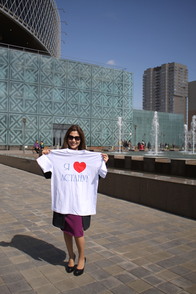 A Kazakh lady all in smiles  with the T-shirt ' I love Astana' after casting her ballot on   election day on April 26th in front of the polling station - Photograph © 2015 Ülle Baum