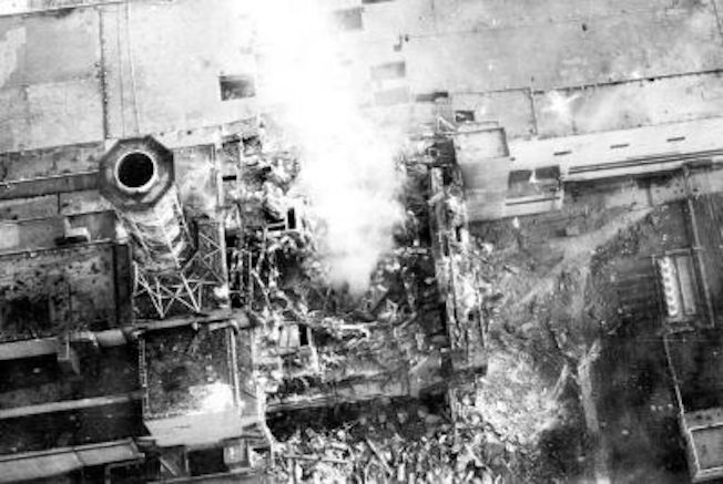 Aerial view of the damaged core on 3 May 1986. Roof of the turbine hall is damaged (image center). Roof of the adjacent reactor 3 (image lower left) shows minor fire damage - photo: www.wikipedia.org