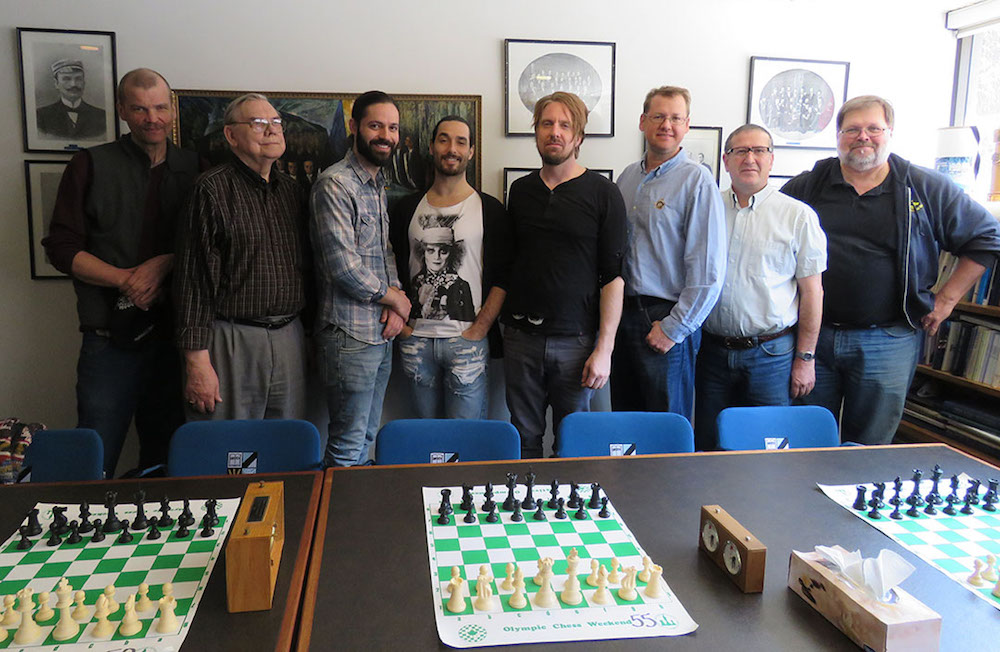 Eight men who play chess. From left to right: Mikk Mölder, Jaak Triefeldt, Michael Celia, Brandon Iannuzzi, Mati Saastamoinen, Alar Petersoo, Farhad Bokaee and Jaak Järve.