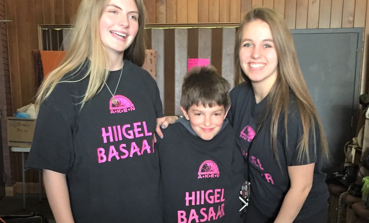 First-time volunteers at Hiigelbasaar #26: in the middle, youngest volunteer Stephane Perron, on the right footwear department whiz-kid Kariina Järve and on the left rummage sale enthusiast and Girl Guide Sylvi Oja.