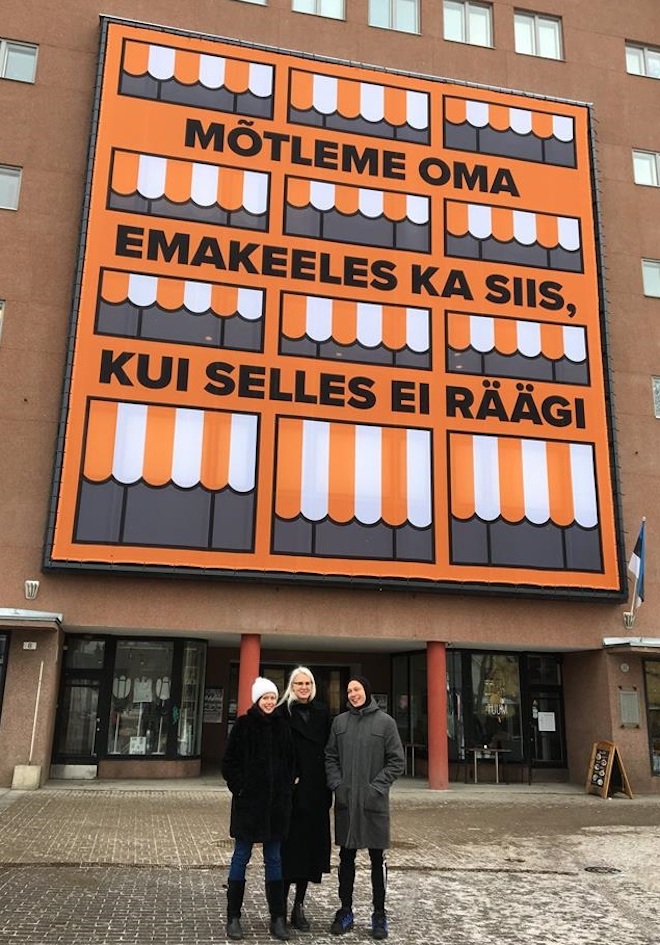 This work of art by Berlin-based Danish artist Lise Harlev is currently getting a lot of exposure due to its location and Estonia’s centenary. It’s on the Tallinna Kunsti/hoone (Art Hall) fassaad facing Vabaduse väljak (Freedom Square). The message: “LET’S / WE THINK IN OUR MOTHER TONGUE EVEN IF / WHEN WE’RE NOT SPEAKING IT”. Or what could be implied is: IF WE DON’T KNOW HOW TO SPEAK IT... In the foreground are Kaarin Kivirähk, Maria Arusoo and Sten Ojavee of the Kaasaegse Kunsti Eesti Keskus (Center for Contemporary Arts, Estonia). Photo: Baltic Triennial (2018)