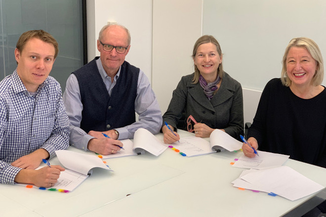 Signing the paperwork for closing the purchase of the 9 Madison Ave. property are, from left to right: Veiko Parming, President of Estonian House in Toronto Ltd., Peeter Einola, Vice-President of Tartu College, Ellen Valter, Board Chair of Estonian (Toronto) Credit Union Ltd., and Eva Varangu, President of Estonian Foundation of Canada.