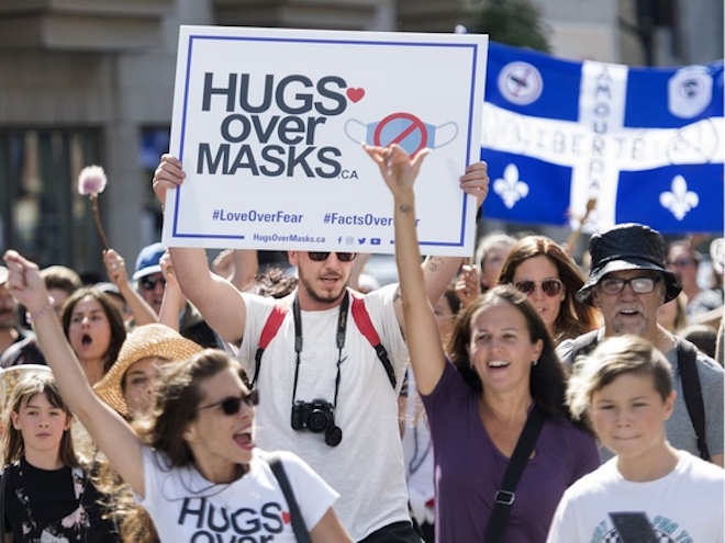 People take part in a demonstration opposing the mandatory wearing of face masks in Montreal last month. PHOTO BY GRAHAM HUGHES /THE CANADIAN PRESS