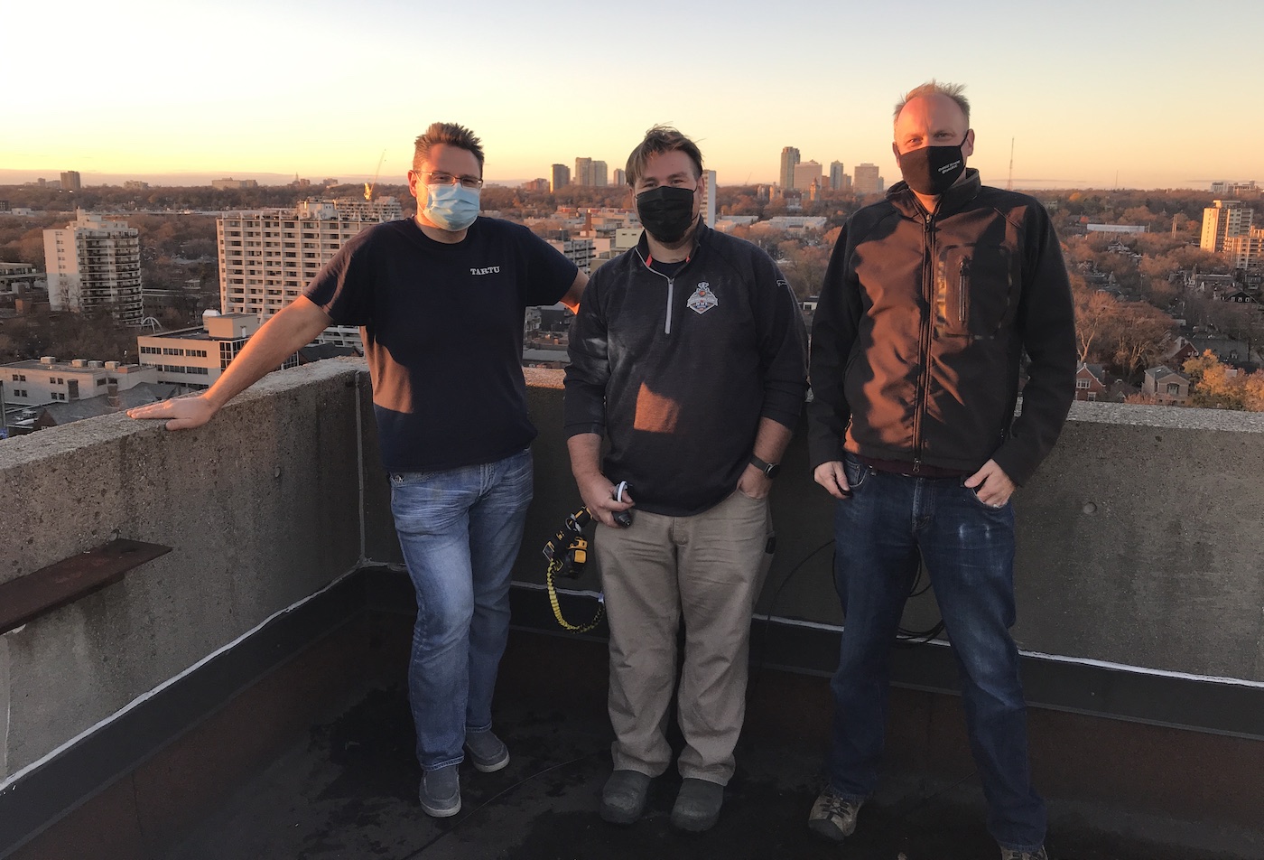 CAP: Time-lapse video project team on the roof of Tartu College, from left: Taavi Tamtik, Sean Hooper and Tarmo Remmel.