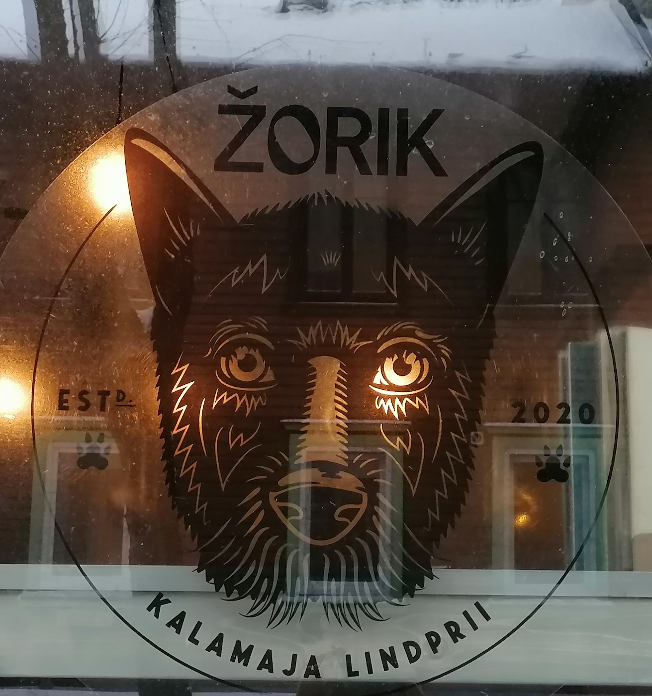 Žorik on the picture window of the *resto* bearing his name in his old haunts of Kalamaja in Tallinn. Photo by Riina Kindlam (2021)