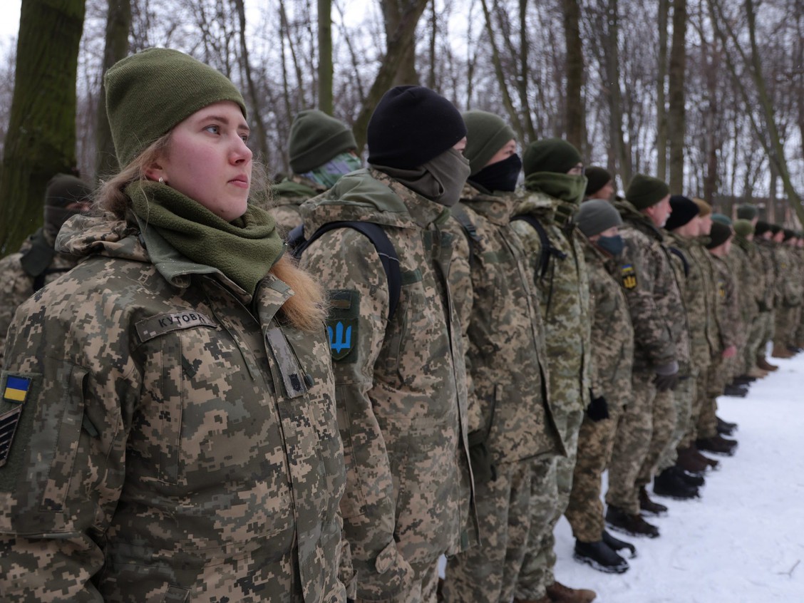 Civilians, including Tatiana, left, 21, a university veterinary medicine student who is also enrolled in a military reserve program, participate in a Kyiv Territorial Defence unit training on a Saturday in a forest on Jan. 22, 2022 in Kyiv, Ukraine. PHOTO BY SEAN GALLUP /Getty Images via torontosun.com