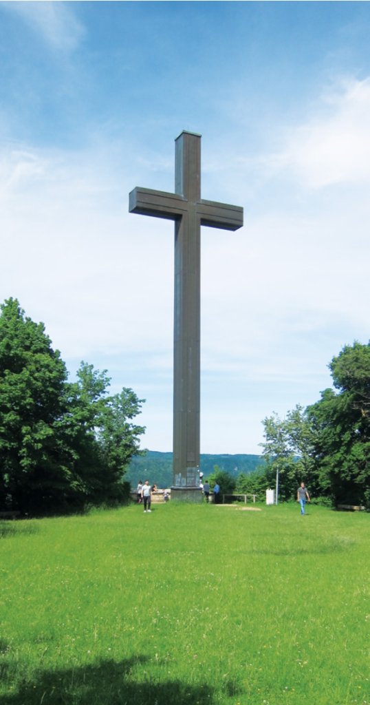 The cross on the top of the moun-
tain up from Karl Strasse where
the Raudsepp family of six lived in
two rooms in a house shared with
another family.