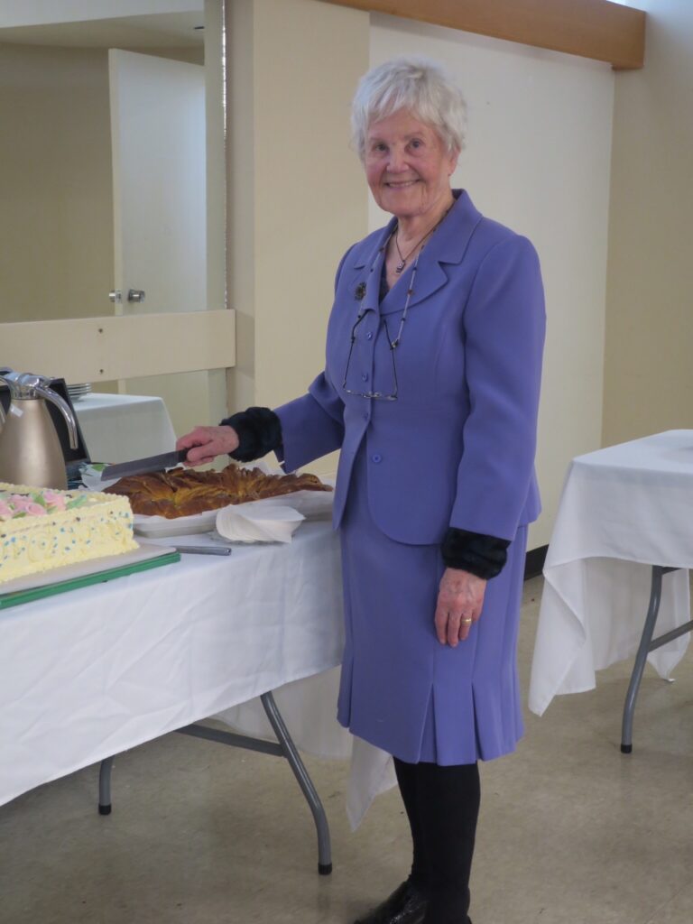 Tamara cutting the cake.