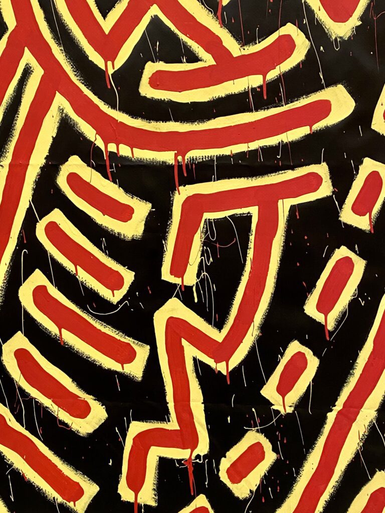 Haring's brushstrokes and line work up close