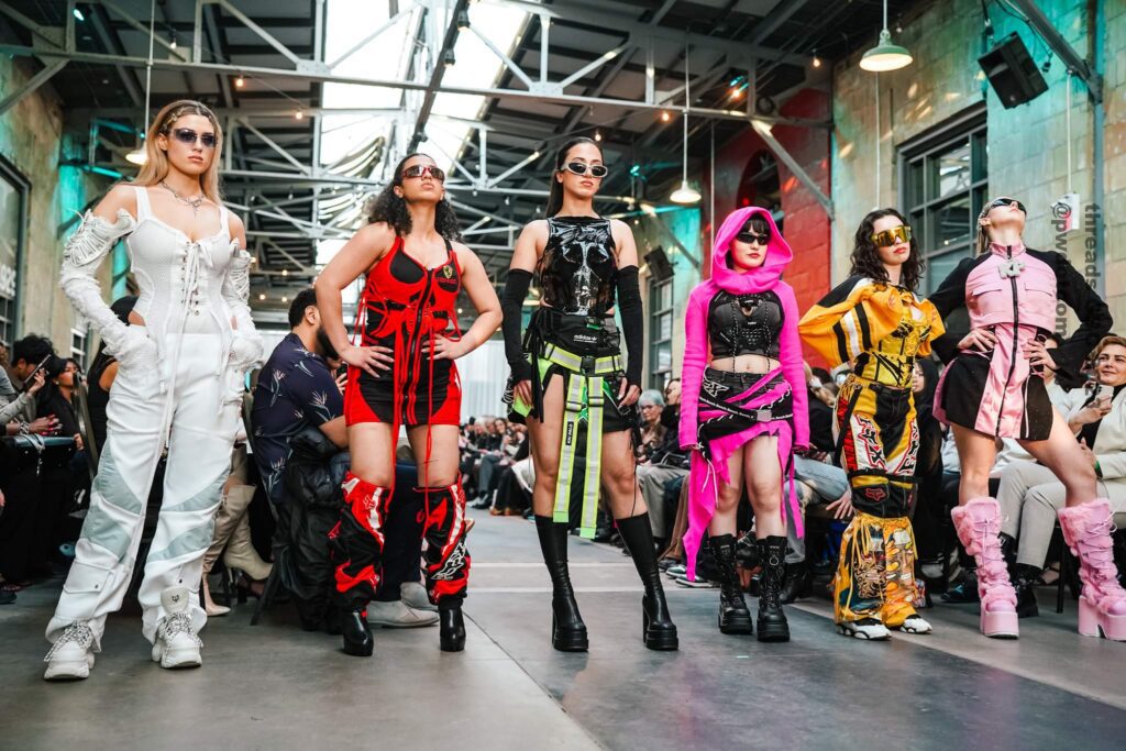 Kai (on the right side in pink and black) showcasing her own collection of streetwear featured at the George Brown Threads 2023 Fashion Show