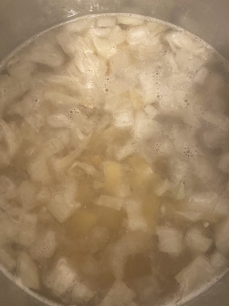 Cooking the onion and potatoes