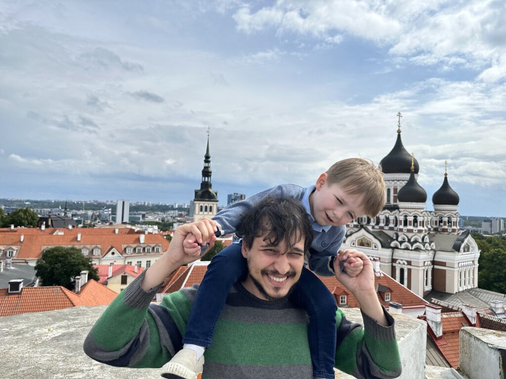 Marili's husband and their son viewing Tallinn from above