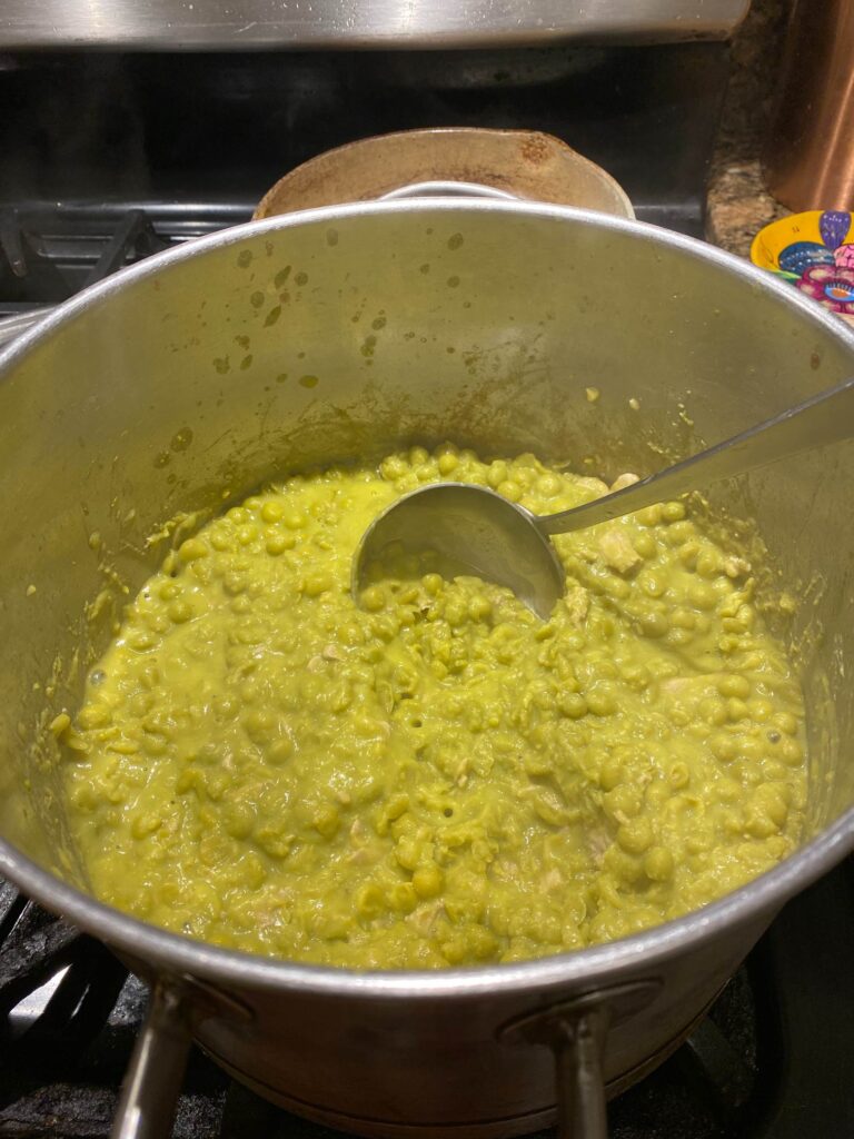 Mashing the peas with a ladle