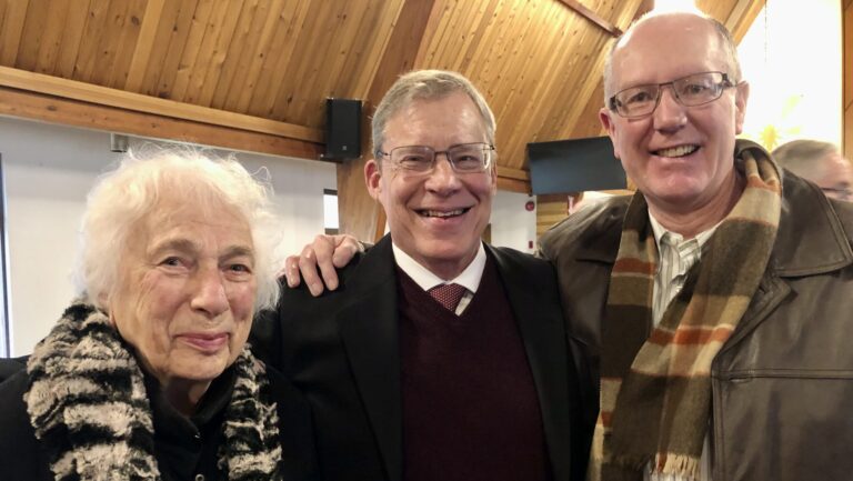 Laine (Tim's mother-in-law), Tim, and Tõnu Naelapea at a Vana Andres congregation service