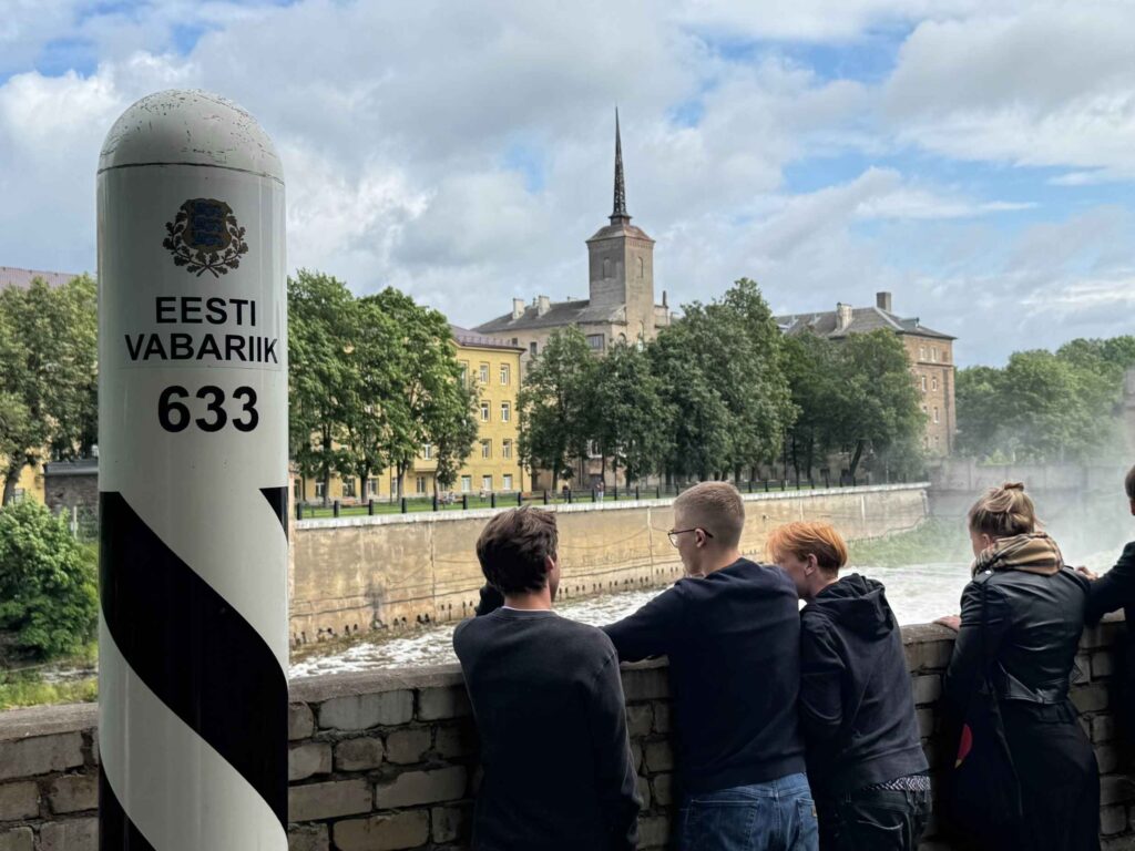 Some youth delegates took a tour at the Kreenholm Manufacturing Company site. Here, some are seen standing on the Estonia-Russia border on the factory grounds