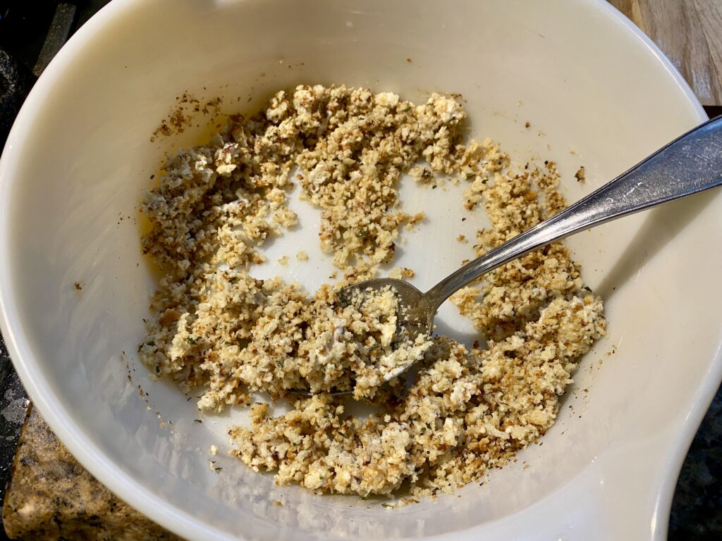 Mixing the toasted panko crumbs with pan-fried garlic and mayonnaise