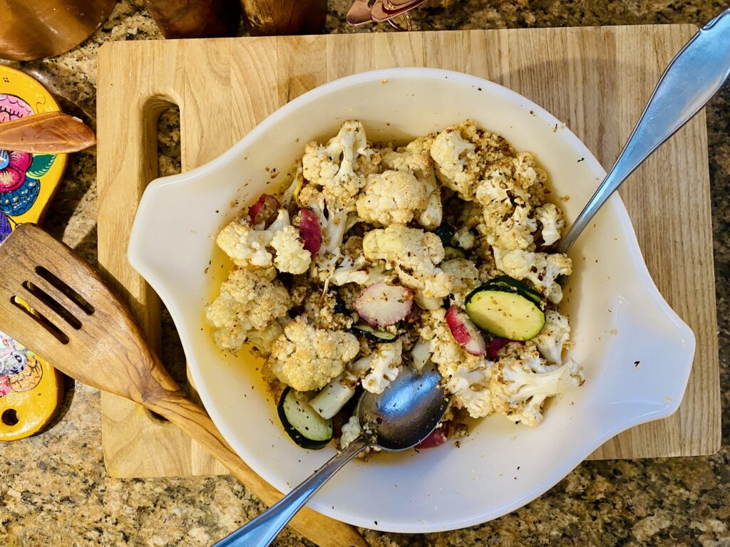Coating the roasted vegetables with the panko