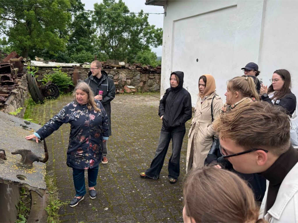 Youth delegates getting a tour at the Vaivara Blue Hills museum