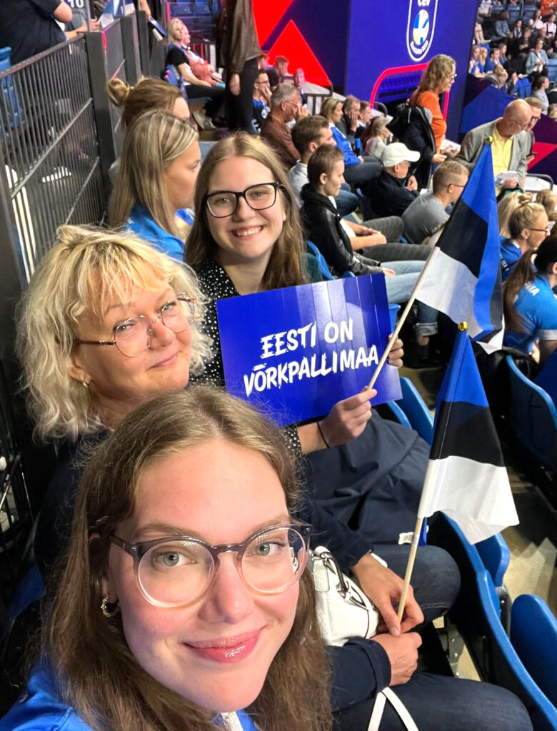 Eliise and Emilie – Kaili and Kaarin’s relatives and trusty proofreaders – with their mom at a volleyball game. Estonian crowds find pride, warmth, and smiles in moments like these.