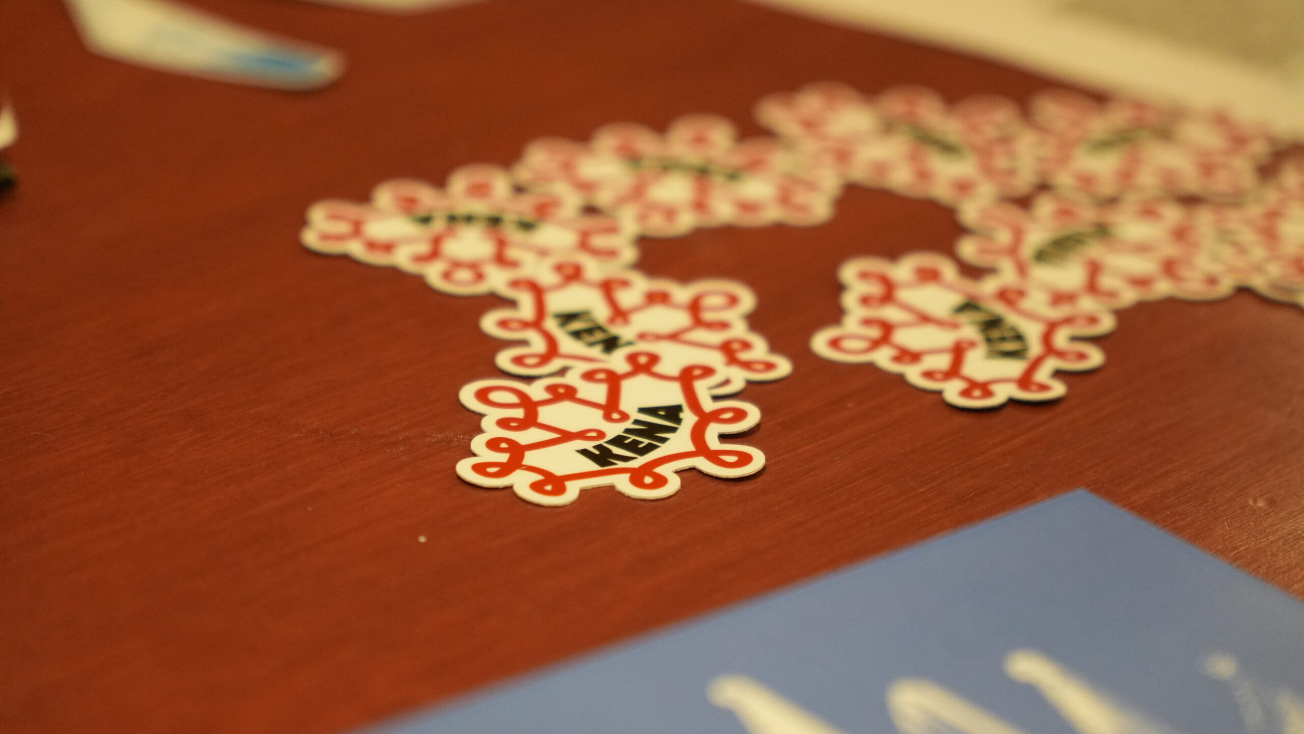 KENA stickers at KENA's psaltery event, by Ruudi Productions.