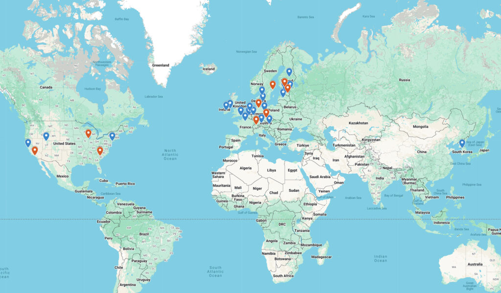 A global map marking applicants (blue pins) and selected delegates (red pins).