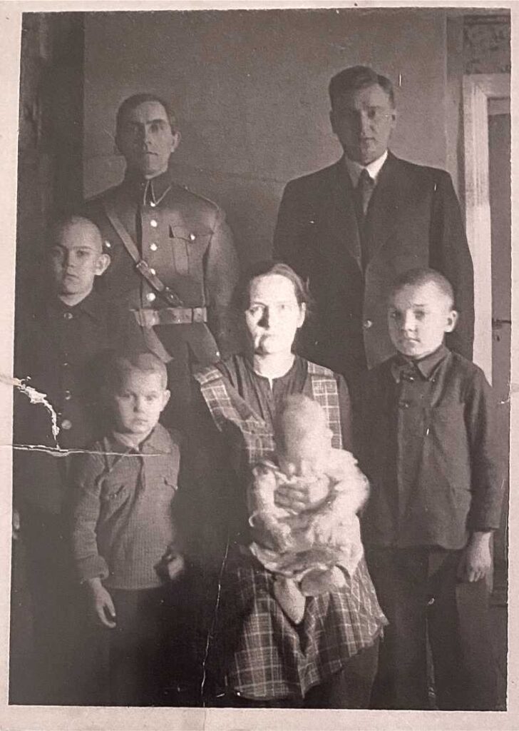 Karl in the arms of his mother, Marie Maru. Back: Mart Maru, Karl's Father, Karl Paldrok, family relative. Brother Peter, Alfred, and Martin Maru. Photo taken in 1937 at Maru Talu, Estonia