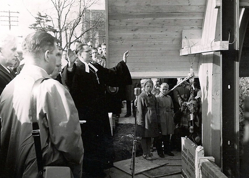 Pastor Oskar Puhm blessing the cornerstone and building in 1955