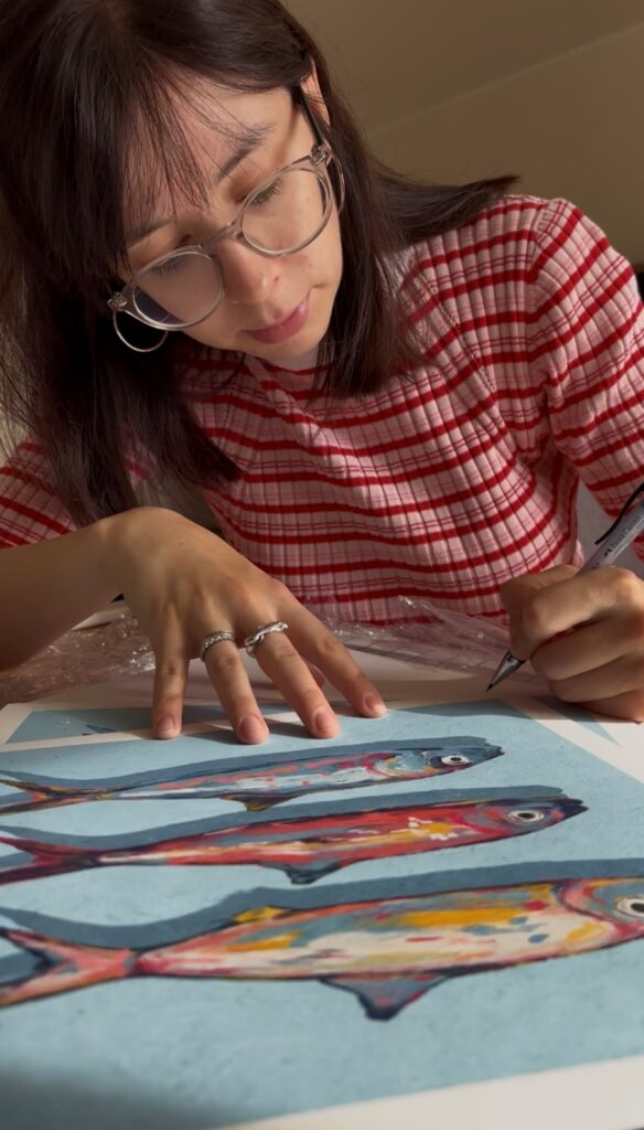 Ksenia Yolk at work on her illustration Herring (photo courtesy of the artist)