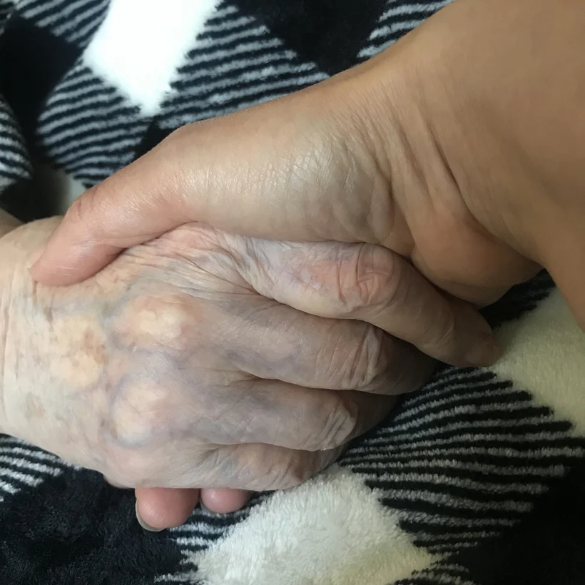Holding hands with Grandma Aino
